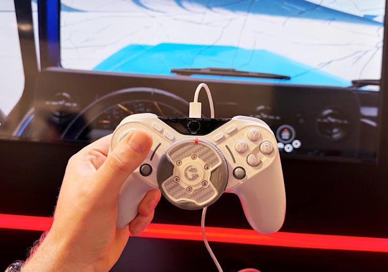 This game controller has a force feedback steering wheel lodged in the middle